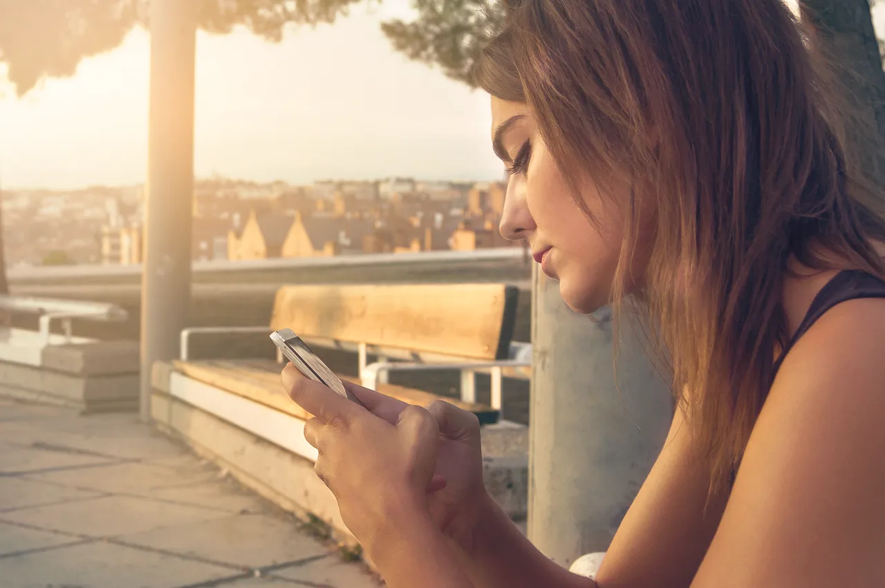 woman, smartphone, technology, communication, texting, chatting, using the phone, young woman, daylight, face, female, girl, hands, mobile phone, model, outdoors, caucasian, smartphone, smartphone, texting, texting, texting, texting, texting, chatting, mobile phone, mobile phone. Celebrity Trivia App Subscription: How to Check the Terms