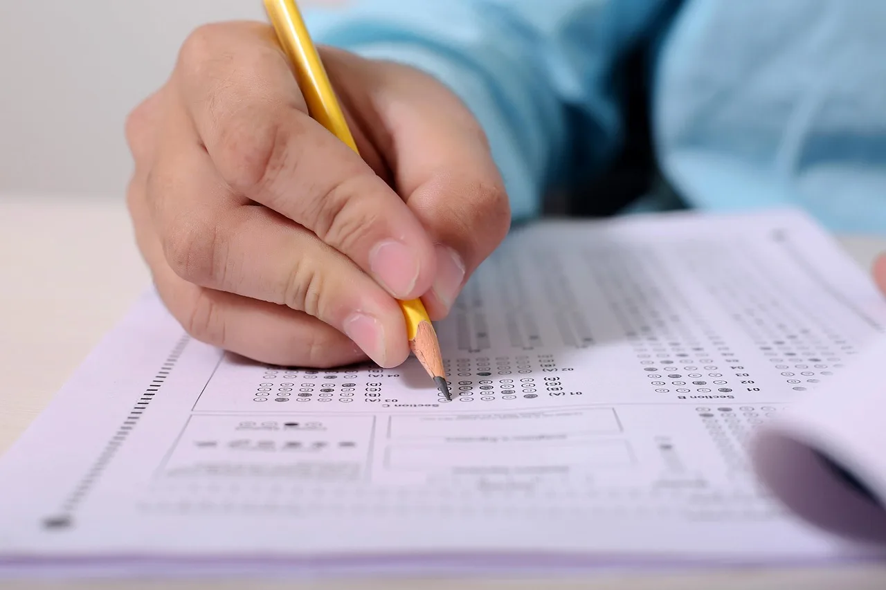 boy, man, people, person, male, adult, portrait, young, hand, fill, circle, exam, educate, pencil, filed, picture, images, sheet, paper, notes, table, desk, wooden, exam, exam, exam, exam, exam. Scoring a recurring celebrity trivia quiz night: teams, disputes and tie-breaks