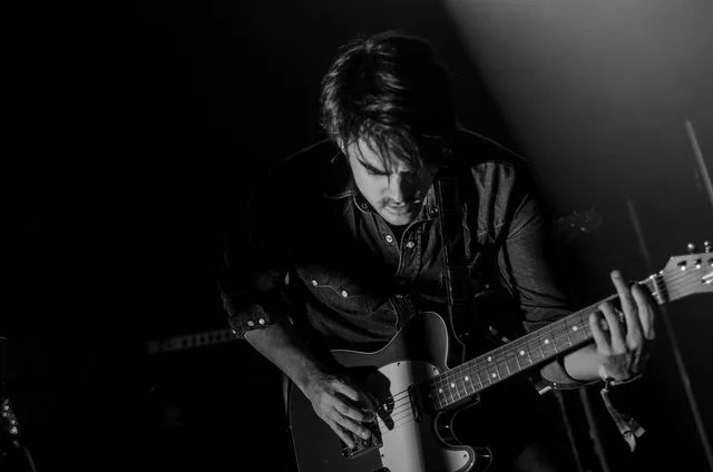 guitar, guitarist, man, music, musical instrument, musician, performance, person, string instrument, black and white, monochrome, guitar, guitar, guitar, guitar, guitar, guitarist, guitarist, music, music, musician, musician. How to Build Hard Music Celebrity Trivia Chains