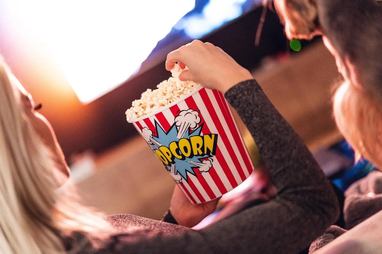 popcorn, girl, food, eating, watching, woman, female, tv, television, snack, entertainment, movie, closeup, popcorn, popcorn, popcorn, popcorn, popcorn, tv. How to Host a Movie and TV Trivia Party Game